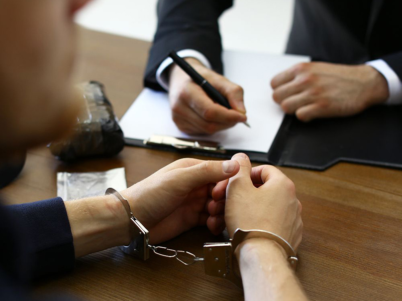 Advocates discussing a case file at Lexcure Legal Solutions, Bhopal
